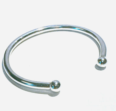 Solid Silver chunky torque bangle on a white background 