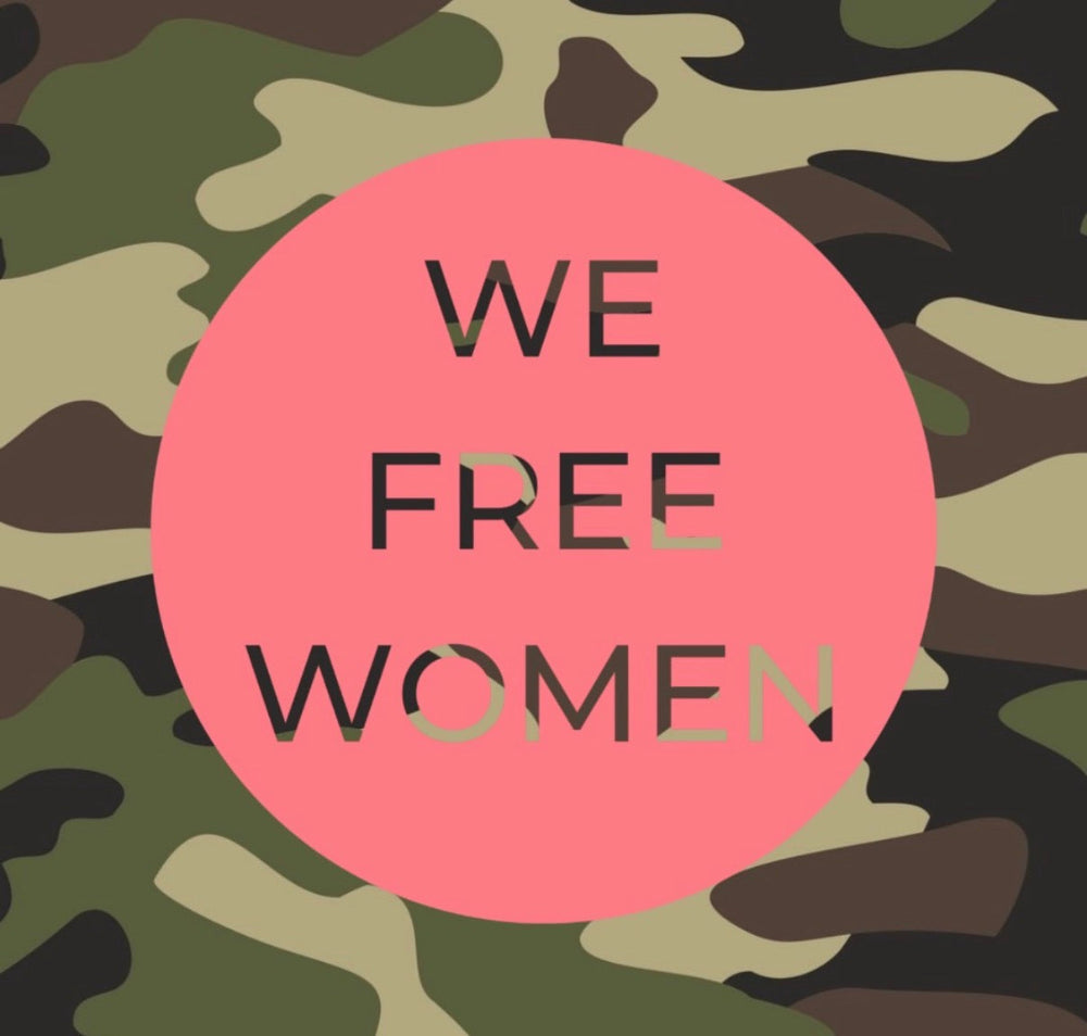Camouflage pattern with a pink circle containing 'WE FREE WOMEN' text